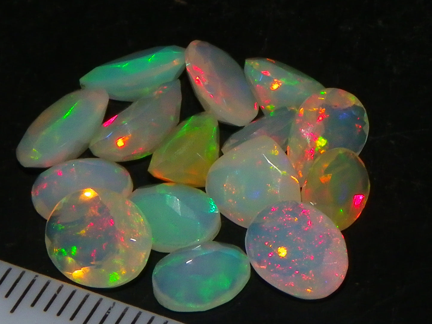 Nice Parcel Faceted/Cut Welo Opals 9cts 15 stones Multicolour Fires Mixed shapes