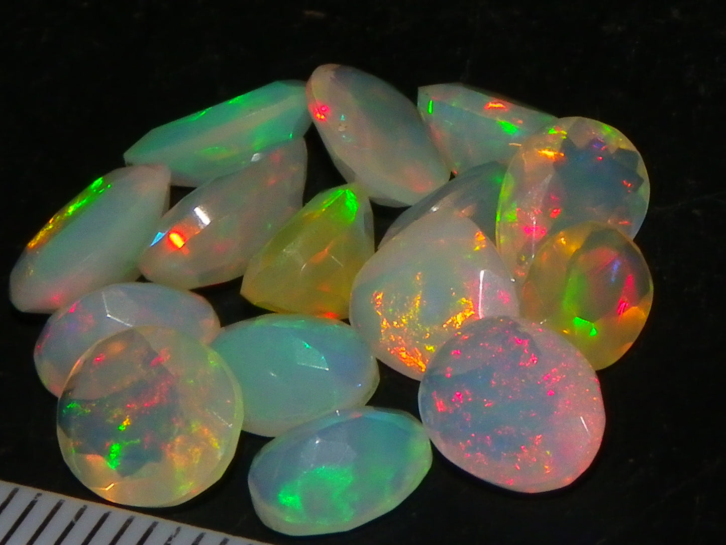 Nice Parcel Faceted/Cut Welo Opals 9cts 15 stones Multicolour Fires Mixed shapes