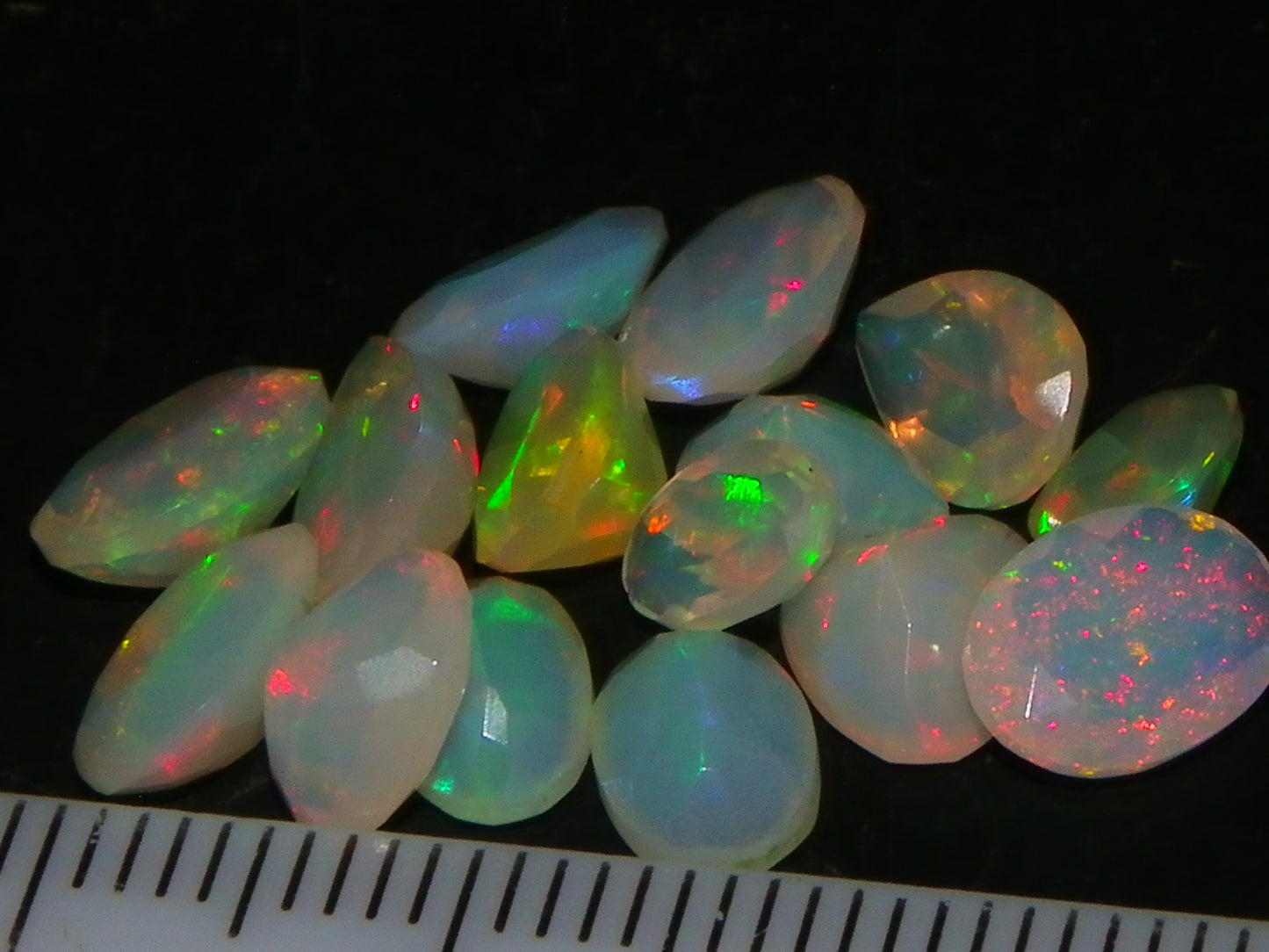 Nice Parcel Faceted/Cut Welo Opals 9cts 15 stones Multicolour Fires Mixed shapes